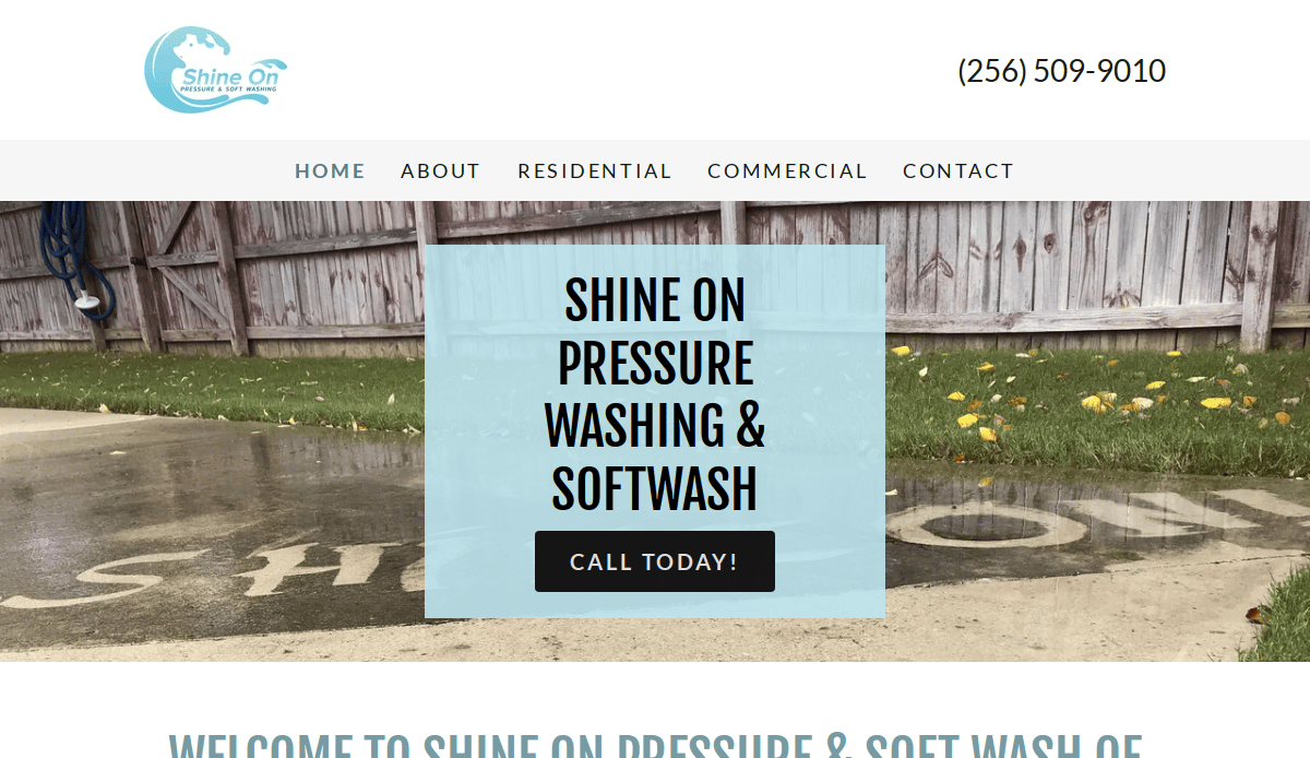 A driveway with SHINE ON written in clean concrete, surrounded by dirt. Text overlay reads: SHINE ON PRESSURE WASHING & SOFTWASH CALL TODAY! with website menu and phone number at the top.