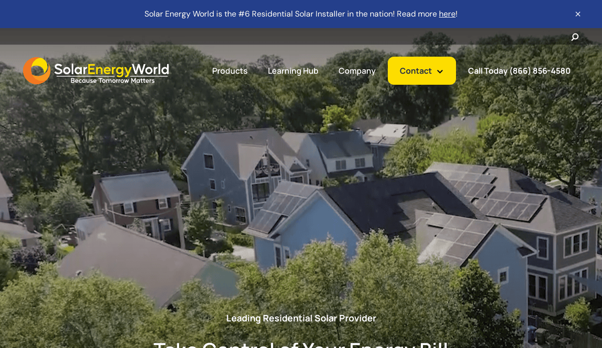 Aerial view of suburban homes with solar panels on rooftops, surrounded by trees. Website banner for Solar Energy World with navigation menu and contact information visible at the top.