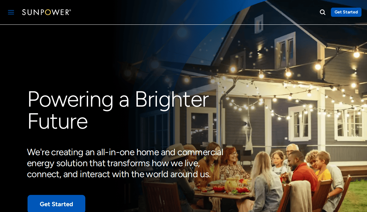 A group of people dine together under string lights on a patio at night, next to a modern house. Text reads, Powering a Brighter Future with information about home and commercial energy solutions.