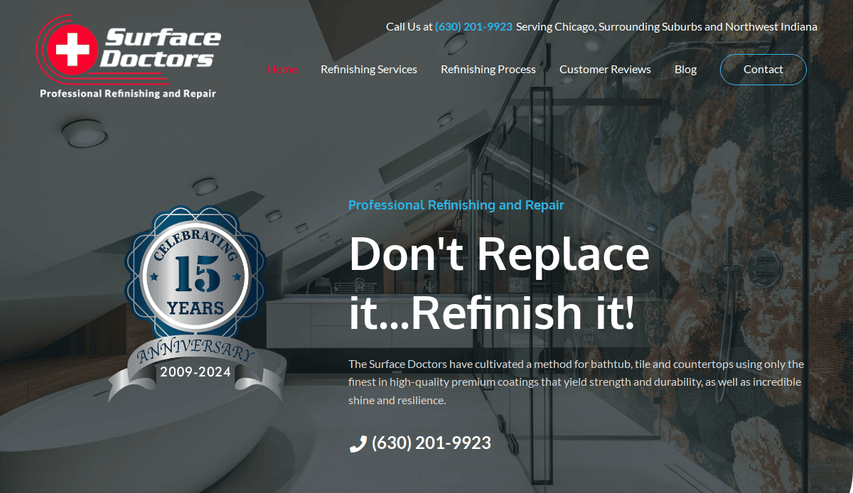 Homepage of Surface Doctors featuring a sleek, modern bathroom with a large bathtub. Text reads: “Don’t Replace it...Refinish it!” and highlights 15 years of professional refinishing and repair services.