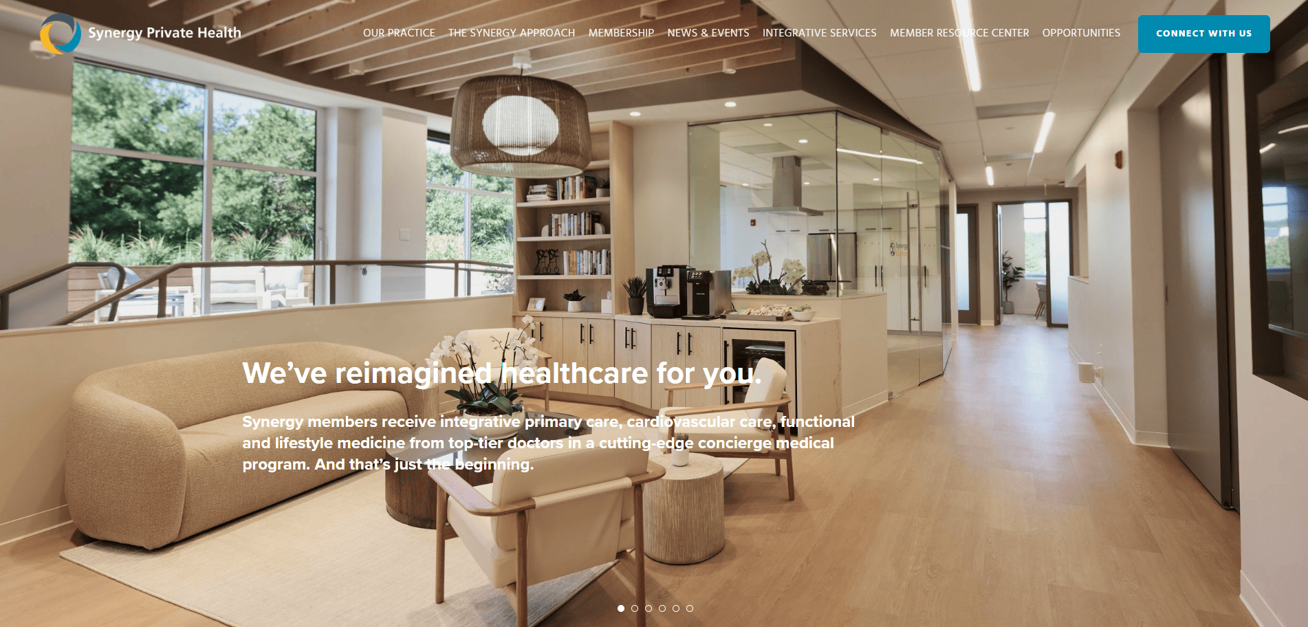 A modern medical office lobby with wooden floors, stylish furniture, a coffee station, and large windows. Text overlay describes Synergy Private Health’s integrative healthcare services and welcoming environment.