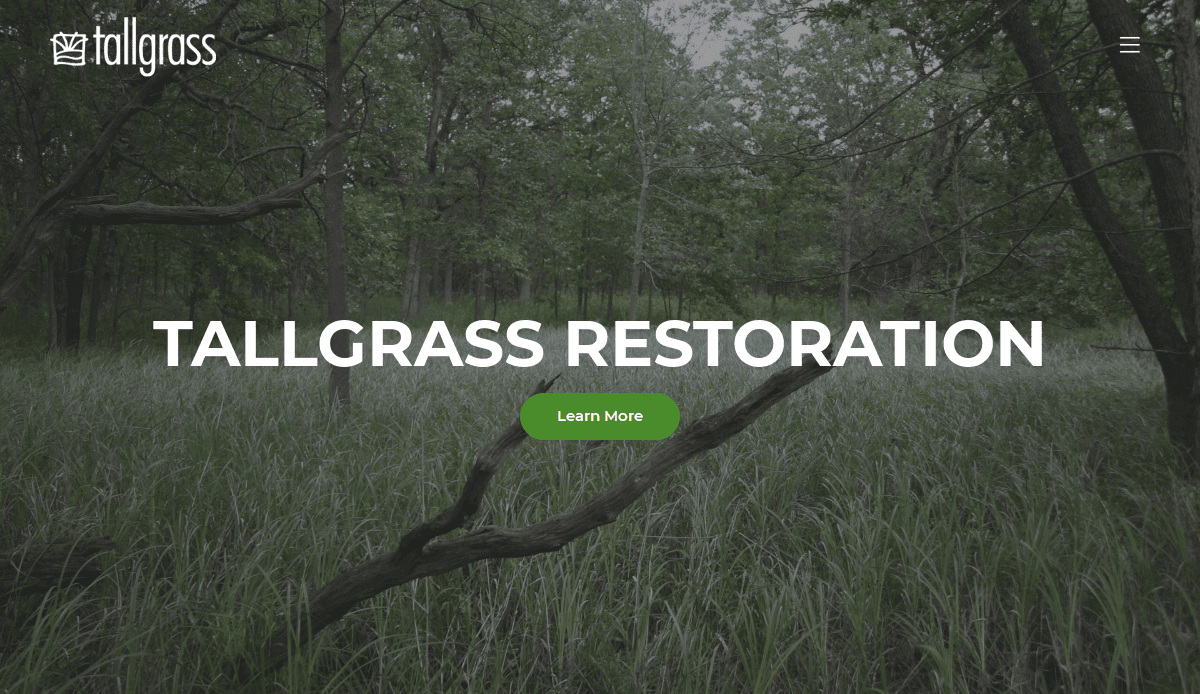 Background of tall grass and trees in a forested area; white text in center reads TALLGRASS RESTORATION above a green button labeled Learn More. The Tallgrass logo appears in the upper left corner.