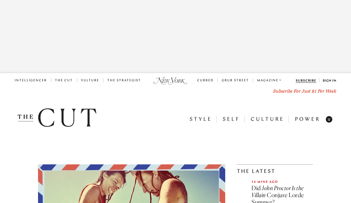 Screenshot of The Cuts website homepage, showing the top navigation bar, site logo, and a partially visible image of two people smiling, along with a Subscribe offer and headlines in the sidebar.