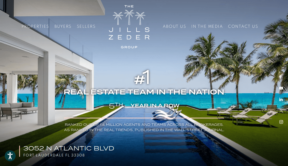 Luxury beachfront property with modern outdoor patio, pool, and palm trees overlooking turquoise ocean. Text highlights Jills Zeder Group as #1 real estate team in the nation for the 5th year, with contact info at the bottom.