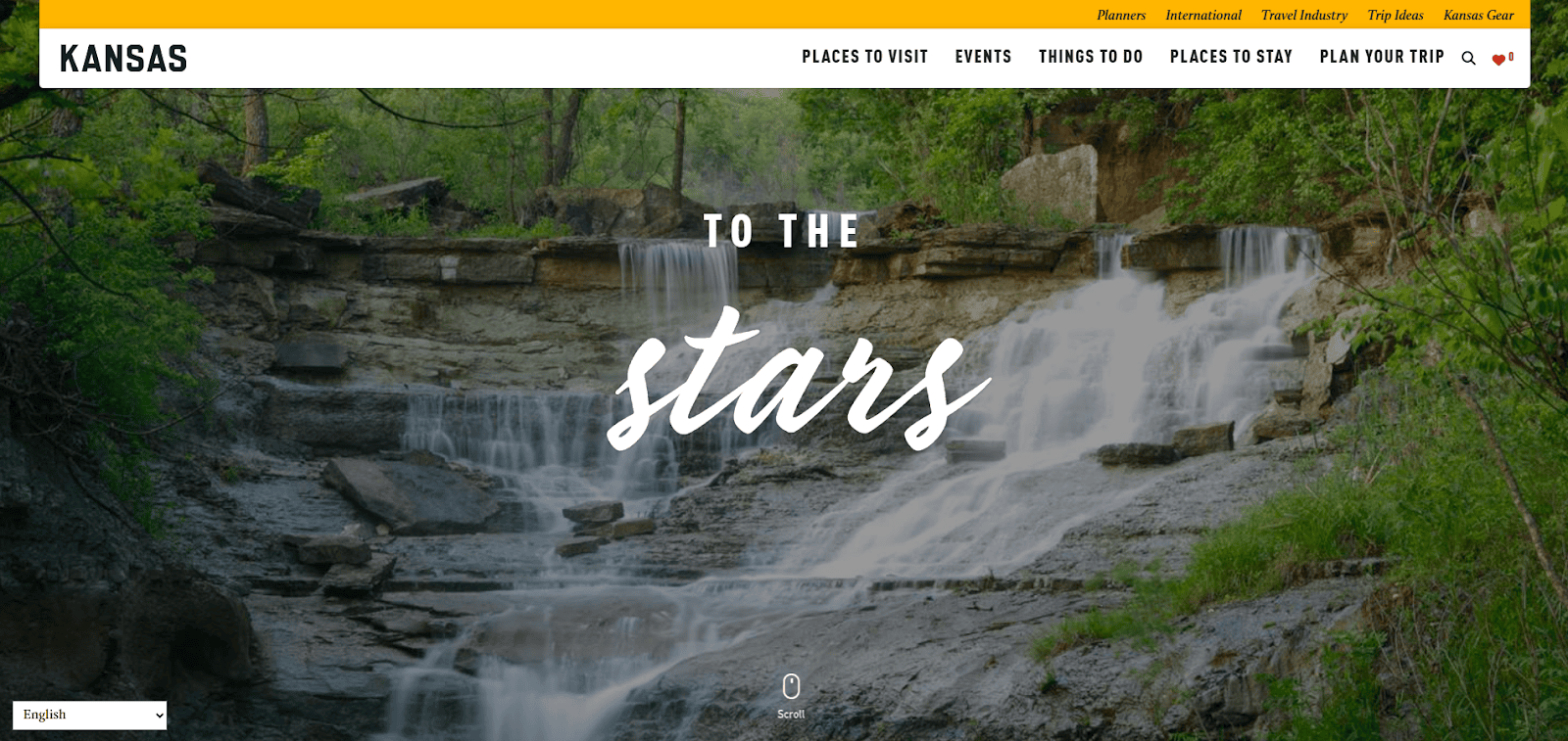 A scenic waterfall cascades over rocky ledges surrounded by lush green trees, with the words TO THE stars in large white text overlaying the image. The top navigation bar features links for Kansas travel information.