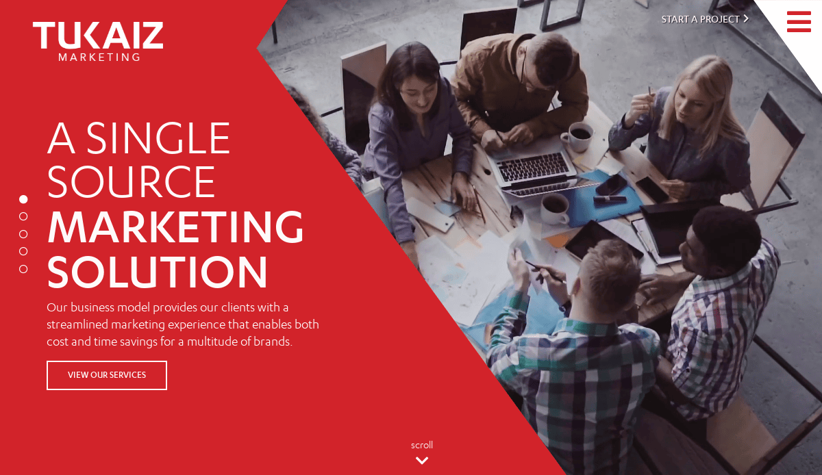A group of five people collaborate around a table with laptops, notebooks, and coffee. The left side of the image features a red overlay with the text TUKAIZ MARKETING: A Single Source Marketing Solution.