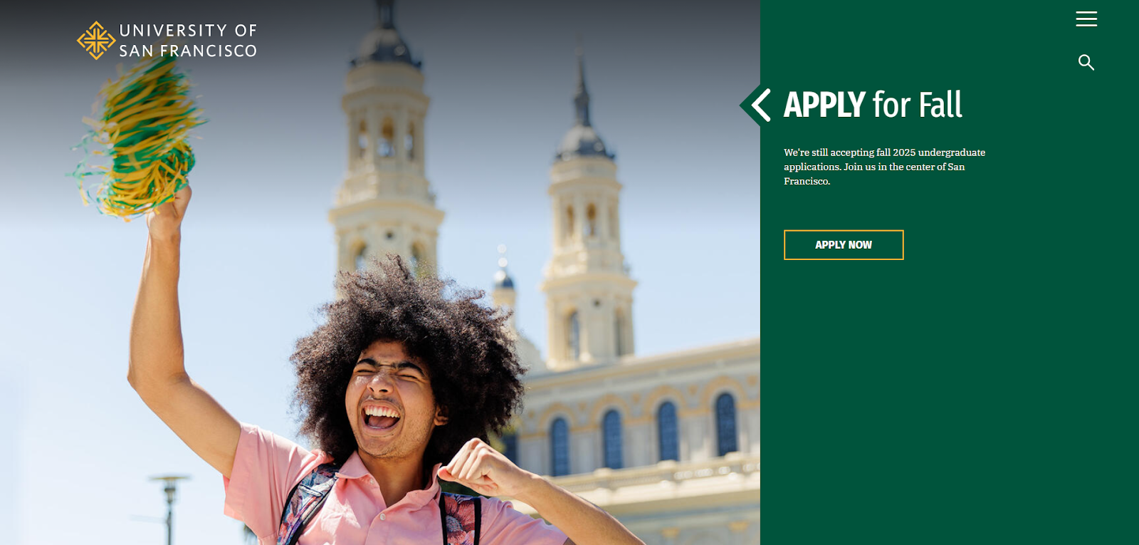 A joyful student with curly hair in a pink shirt waves green and yellow pom-poms in front of the University of San Francisco’s campus. Text on the right reads, “Apply for Fall” with an “Apply Now” button.