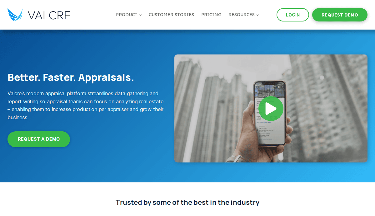 Screenshot of Valcre’s website showing a hand holding a smartphone with a property appraisal app onscreen, alongside text promoting faster, better appraisals and a green Request a Demo button.