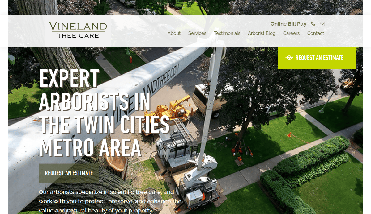 Aerial view of arborists using a crane to trim large trees by a house. Website header reads “Vineland Tree Care,” with navigation links and a “Request an Estimate” button highlighted in green.