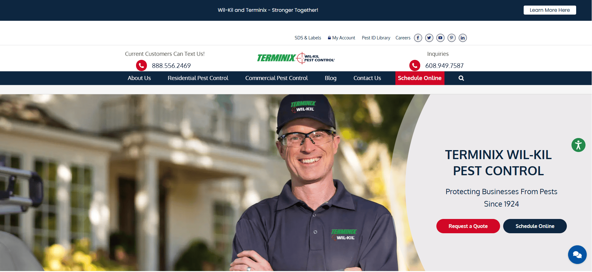 A smiling Terminix Wil-Kil Pest Control employee in uniform stands outside a house. The website header shows contact information, service links, and buttons to request a quote or schedule online.