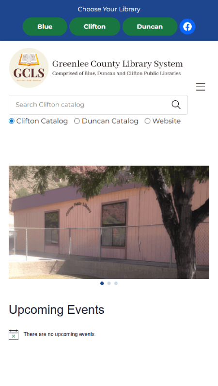 Screenshot of the Greenlee County Library System website featuring the header, navigation bar, search options, an “Upcoming Events” section with no events listed, plus Greenlee County library contact information and hours.