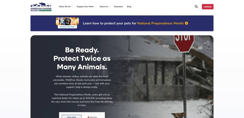 Screenshot of the American Humane Society website showing a banner about National Preparedness Month and a main section with text urging people to protect animals during disasters. A dog stands near a stop sign in snowy conditions.