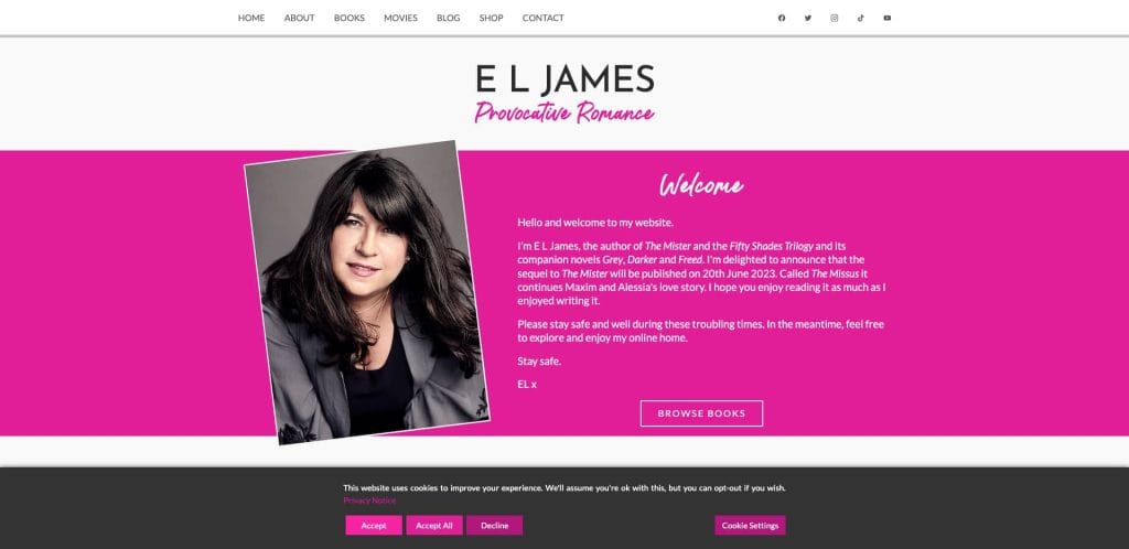 Screenshot of E L Jamess website homepage, featuring a large photo of the author on the left, a welcome message in the center, and navigation links along the top in a pink, black, and white color scheme.