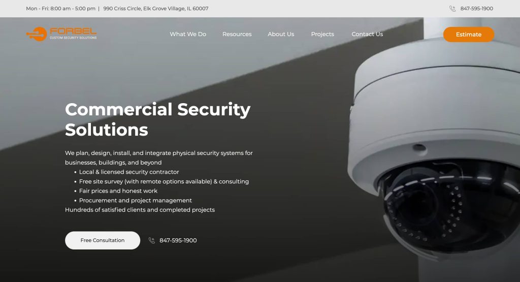 A close-up of a white security camera is shown on the right, with text on the left promoting commercial security solutions, including system design, installation, and integration. The companys name, Forbel, is at the top.
