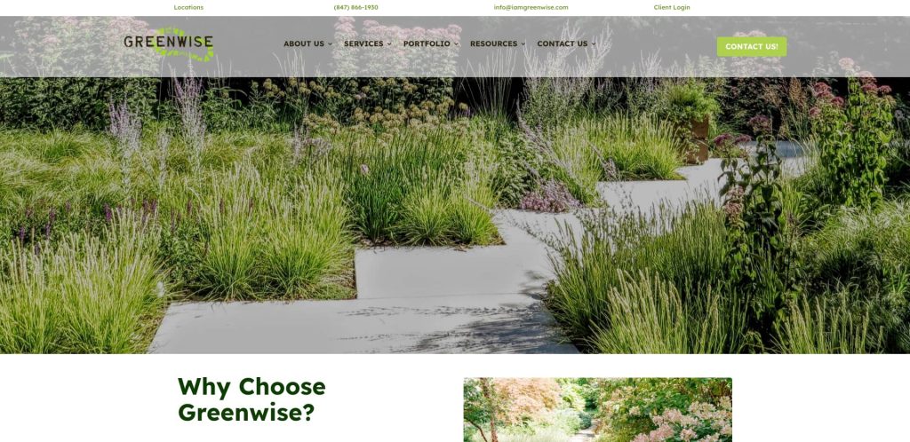 A landscaped garden with concrete pathways winding through tall grasses, shrubs, and flowering plants, featured on the Greenwise website header. The site menu and contact button are visible at the top.