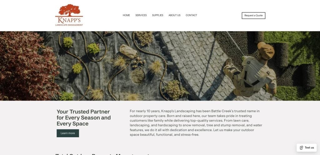 Aerial view of a landscaper working with plants and pathways. The Knapp’s Landscaping logo is at the top left, and a navigation menu and contact button are at the top. A headline and text about the company appear below the image.