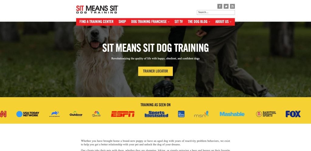 A golden retriever sits beside a trainer on grass. The website banner reads SIT MEANS SIT DOG TRAINING with a yellow Trainer Locator button, logos of media outlets, and navigation links at the top.
