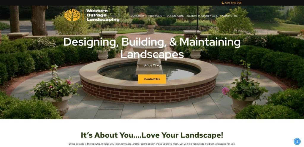 A landscaped patio features a central round stone fountain, surrounded by brick paving, benches, potted plants, and greenery. The Western DuPage Landscaping website offers landscape services, with a contact button in the center.