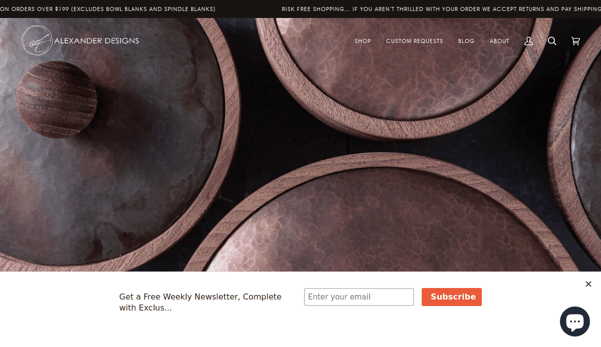 Close-up view of several round, wooden-lidded copper containers with a hammered texture, displayed on a dark background—perfect for an artisan website design. A newsletter subscription box appears at the bottom of the image.