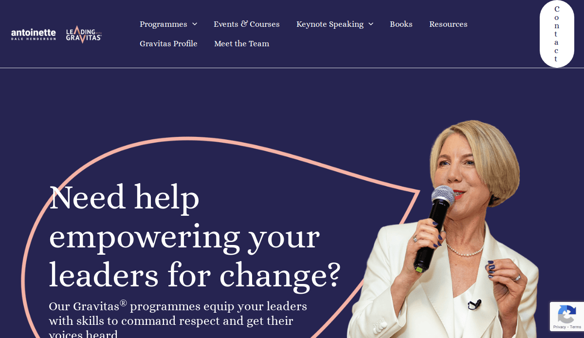 A woman in a white suit speaks into a microphone on stage. Behind her, white text reads, Need help empowering your leaders for change? on a dark blue background—perfect inspiration to build a coaching website with purpose. Navigation and contact options are visible.