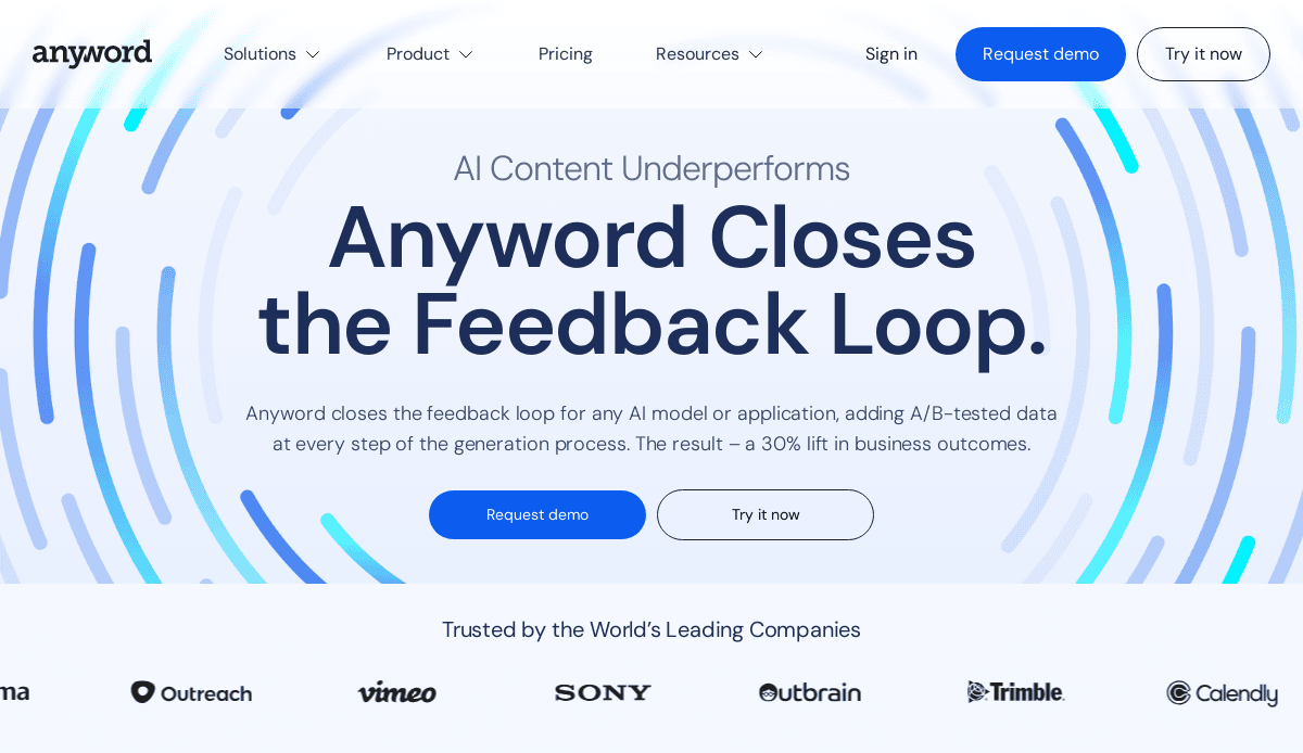 Screenshot of Anyword’s homepage featuring the headline “Anyword Closes the Feedback Loop,” a description of its AI content tool for website strategy, blue circular graphics, and “Request demo” and “Try it now” buttons. Company logos appear at the bottom.