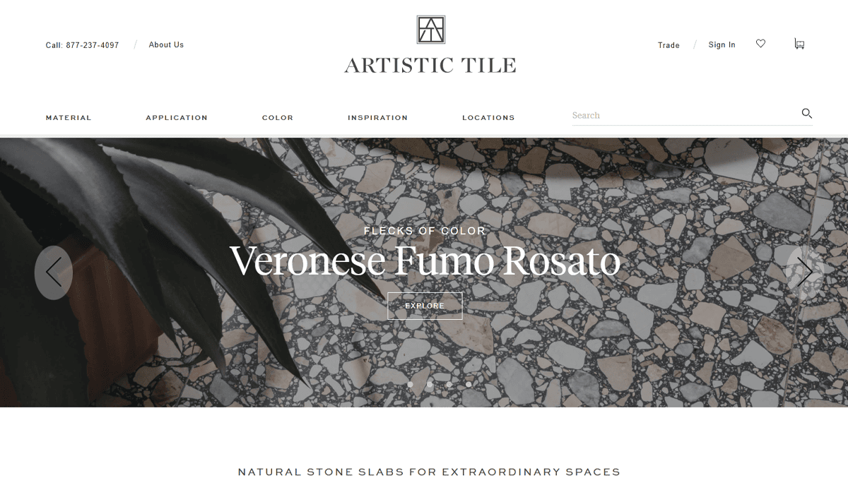 Homepage of Artistic Tile featuring a close-up of Veronese Fumo Rosato stone tile with grey, white, and pinkish flecks, a plant in the corner, and a headline highlighting color, style, and performance—a perfect inspiration for tile contractor website design.