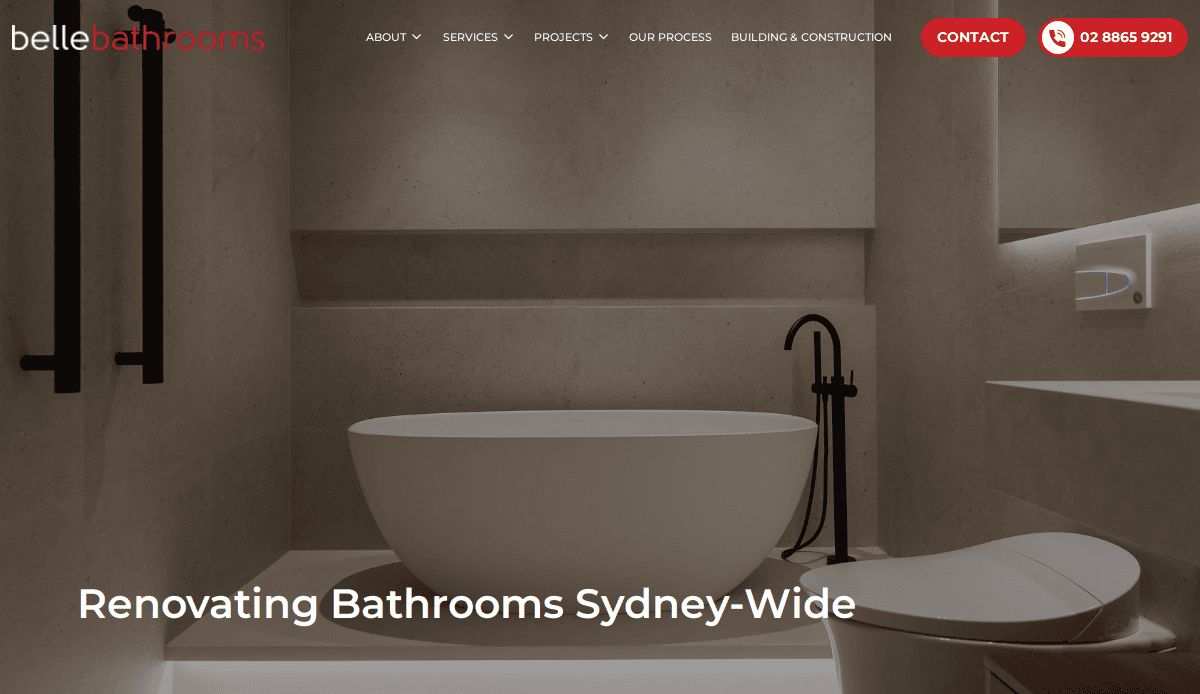 A modern, minimalistic bathroom with a freestanding white bathtub, black fixtures, a wall-mounted toilet, and soft, warm lighting. Text reads: Renovating Bathrooms Sydney-Wide—Bathroom Remodeling to Convert Visitors into Clients.