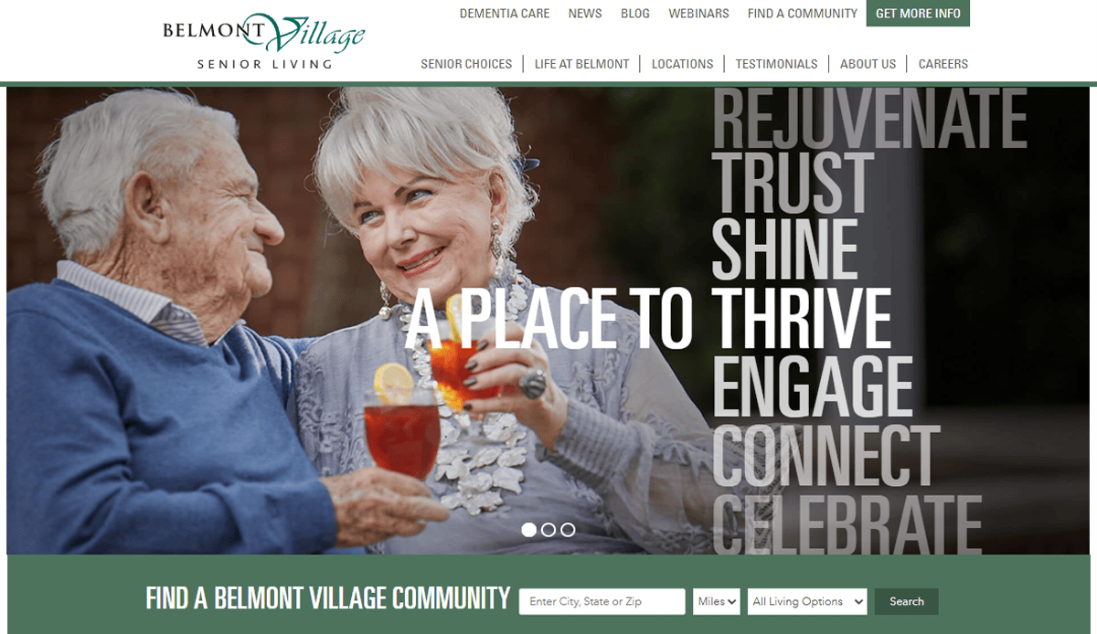 An elderly man and woman sit outdoors, smiling and clinking glasses, with inspiring words like “Rejuvenate,” “Trust,” “Thrive,” and “Celebrate” overlaid—reflecting the spirit of high-performing assisted living website design. Belmont Village Senior Living branding appears at the top.