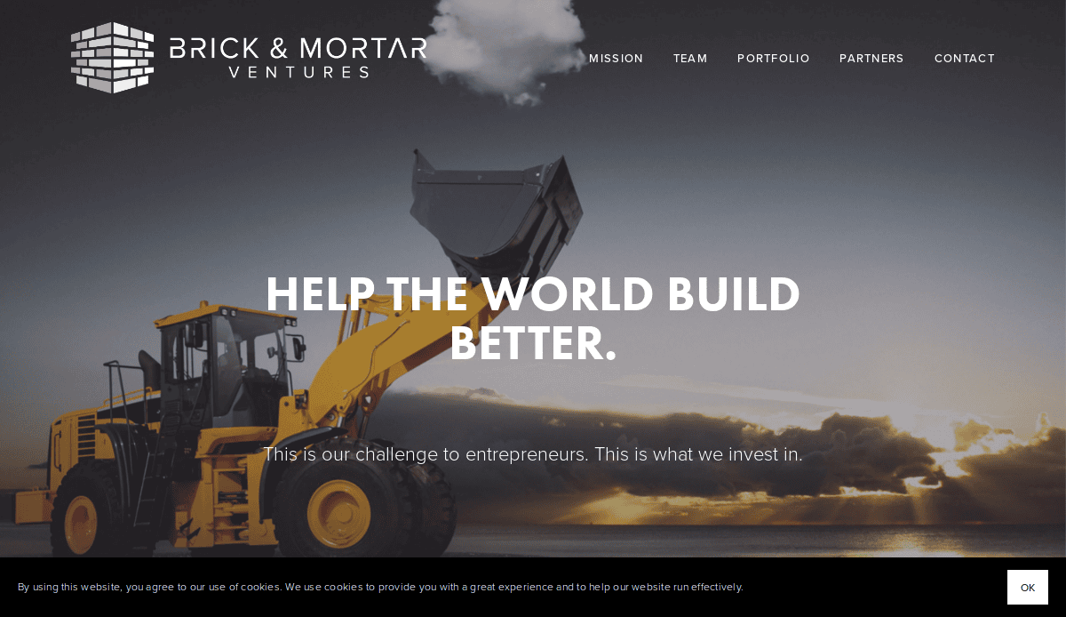 A yellow front loader lifts a bucket in front of a cloudy sunset sky. The Brick & Mortar Ventures logo and navigation menu appear at the top, with the text Help the world build better, showcasing expert masonry website design, overlaid in large font.