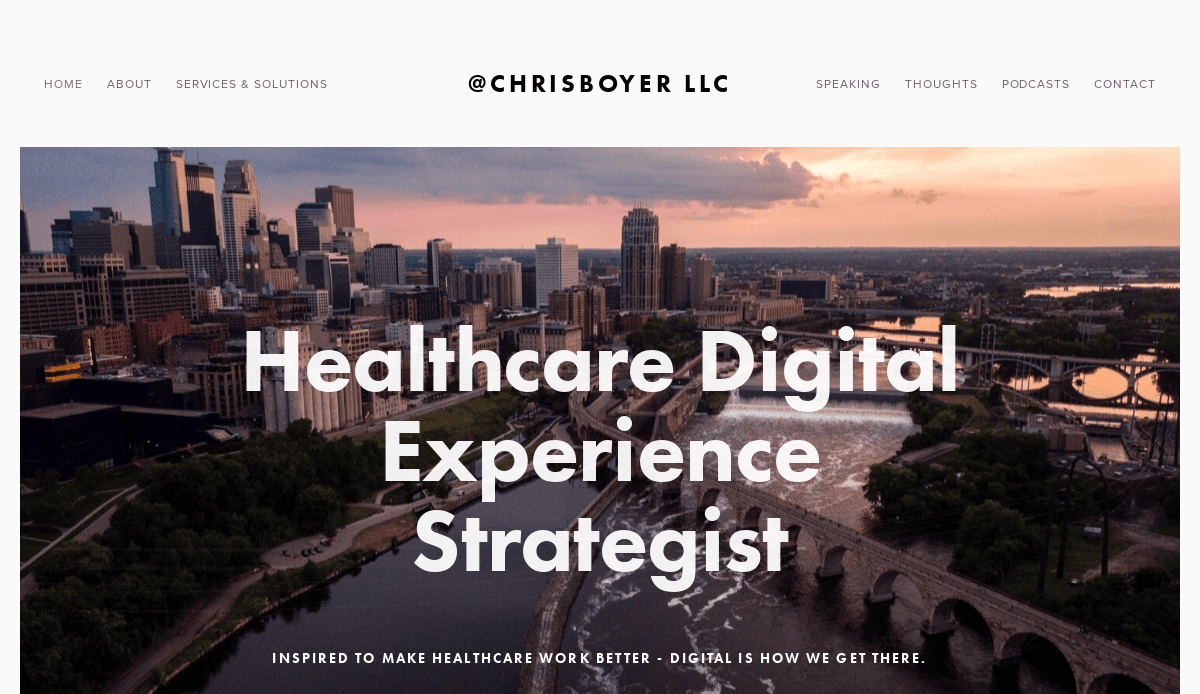 Aerial view of a city skyline at sunset with a river and bridges in the foreground. Text reads: Healthcare Digital Experience Strategist—expert in consultant website design, with a header for Chris Boyer LLC and a navigation menu at the top.