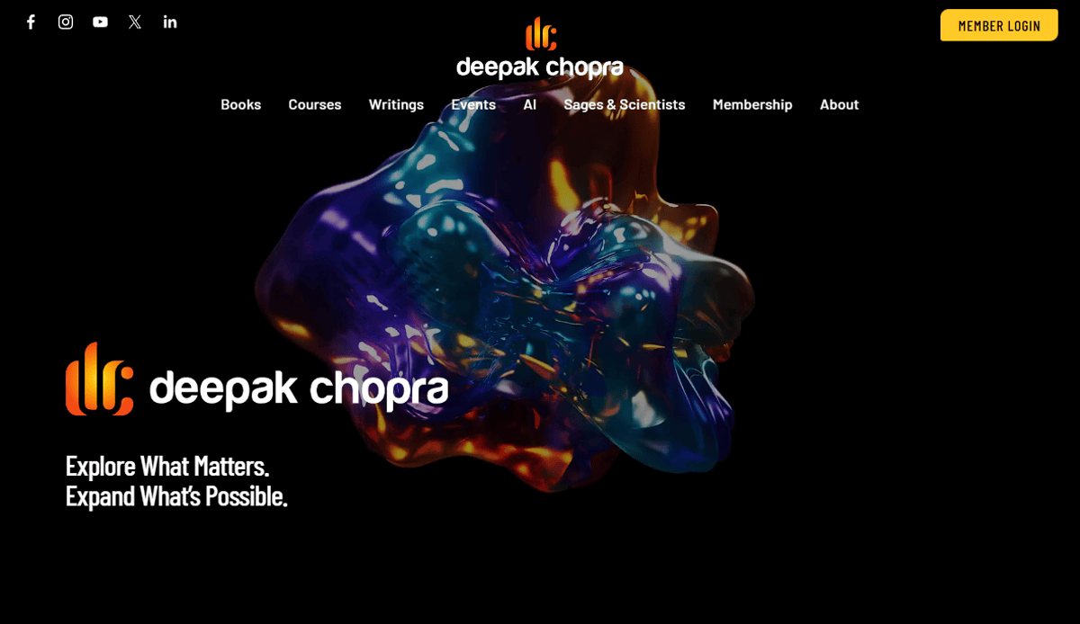 Screenshot of Deepak Chopra’s health & wellness website homepage featuring a colorful abstract 3D shape on black, navigation links, social icons, the logo, and “Member Login.” Text reads: “Explore What Matters. Expand What’s Possible.”.