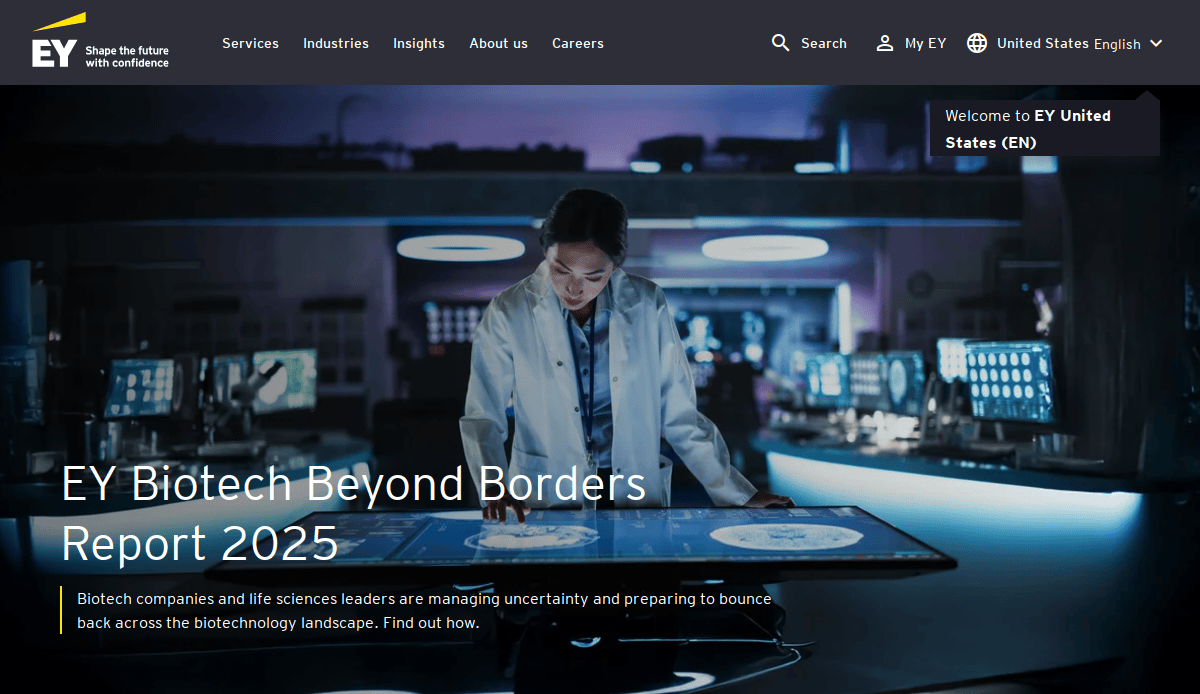 A scientist in a lab coat interacts with a high-impact touch screen displaying data, surrounded by advanced lab equipment. The screen shows EY Biotech Beyond Borders Report 2025 and EY branding is visible at the top, building a sense of innovation.