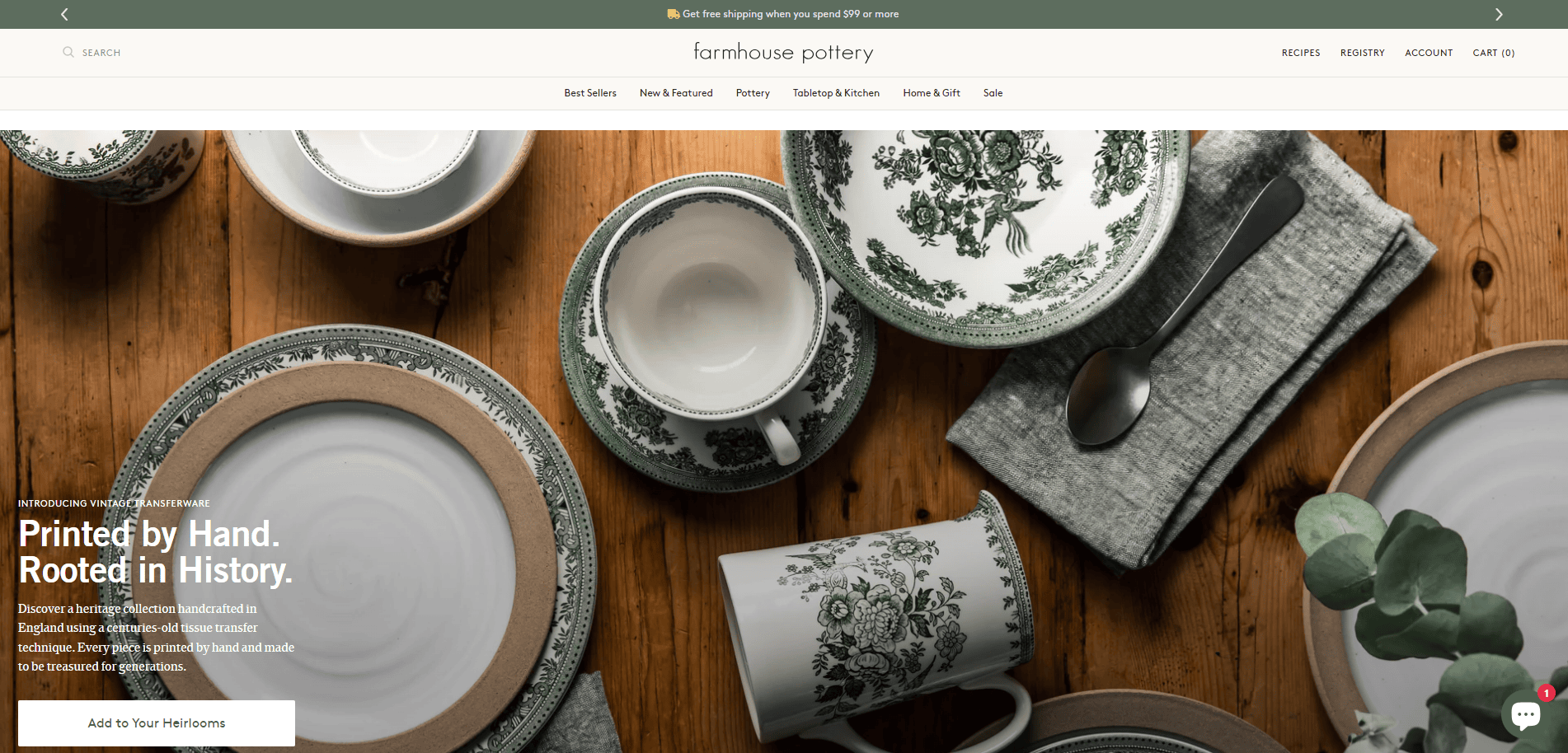 A wooden table set with green and white patterned plates, bowls, teacups, and saucers, alongside gray cloth napkins and silverware, is displayed for Farmhouse Pottery—an inviting scene perfect for an artisan website design. Handcrafted ceramics text overlay.