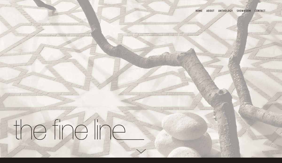 A decorative branch and stacked white stones rest on a geometric, star-patterned surface, evoking balance and performance. In the lower left, the words the fine line appear in thin lettering. Navigation links enhance this tile contractor website design above.