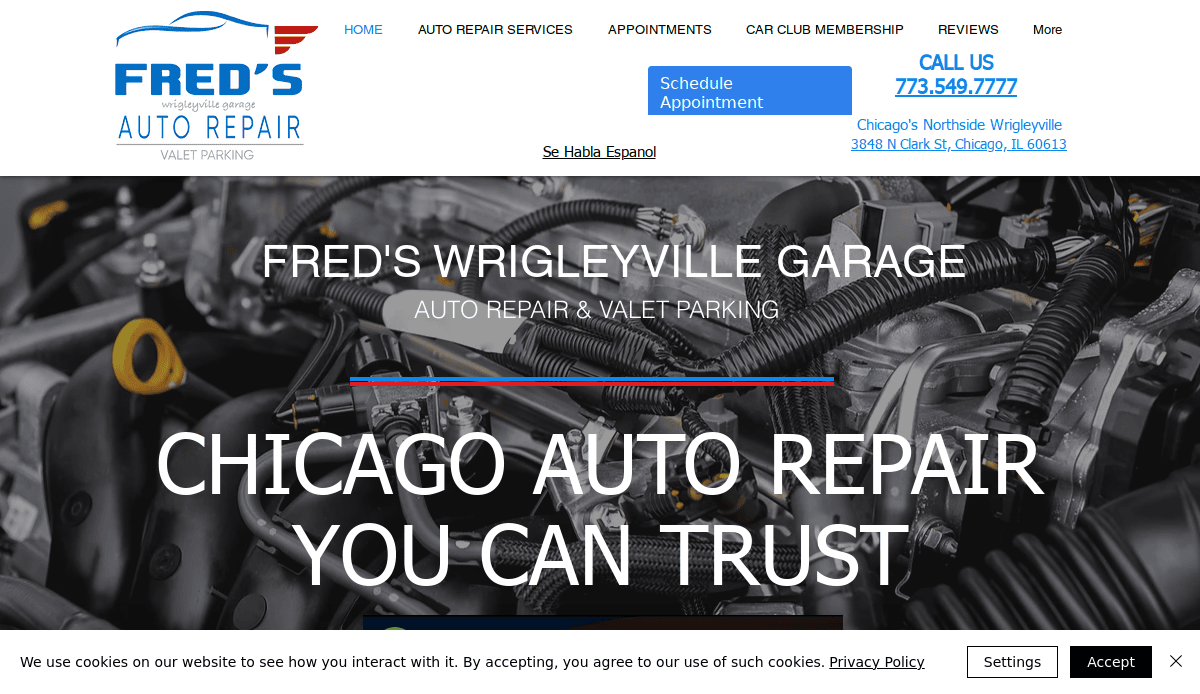 Screenshot of Fred’s Wrigleyville Garage website, showcasing their logo, navigation menu, contact info, and a background image of a car engine with “CHICAGO AUTO REPAIR YOU CAN TRUST”—a great example of effective automotive website design.