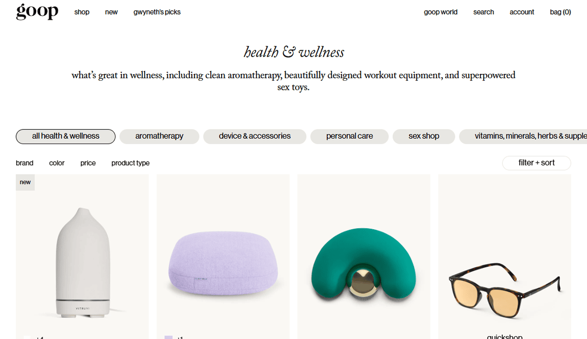 A health & wellness website page from Goop features categories like aromatherapy and personal care, showcasing four products: a white diffuser, a lavender pillow, a green massage tool, and tan sunglasses.