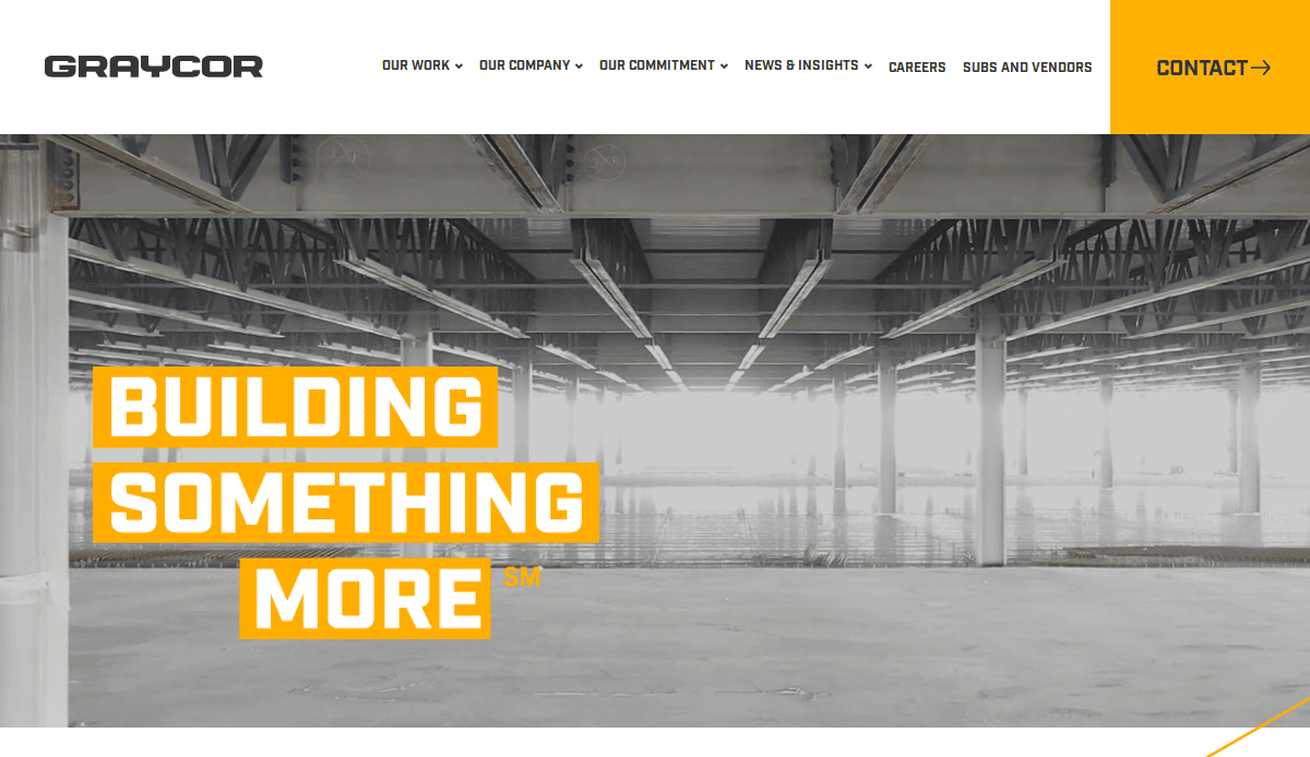Screenshot of the Graycor website featuring their logo, navigation menu, and a striking image of an unfinished building interior. The bold "BUILDING SOMETHING MORE" tagline highlights a website design that attracts and converts visitors.
