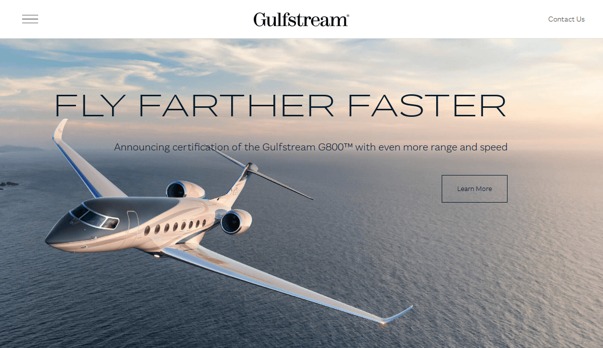 A Gulfstream G800 jet flies over the ocean at sunset with text reading “Fly Farther Faster—Announcing certification of the Gulfstream G800 with even more range and speed, future-proofing your journey.” A “Learn More” button appears on the right.