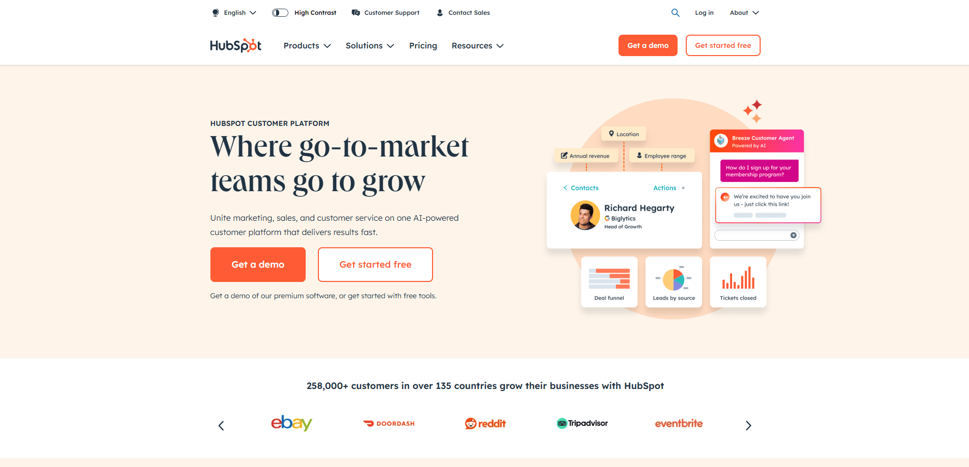 Screenshot of HubSpot’s homepage showcasing a B2B website design focused on growing go-to-market teams, with demo and free trial options, customer reviews, product features, and logos from brands like eBay, DoorDash, Reddit, Tripadvisor, and Eventbrite.