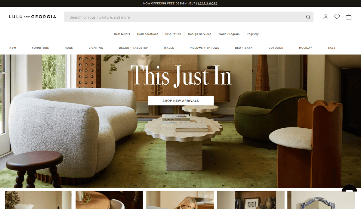 A stylish living room with a white boucle sofa, wavy-edged coffee table, and elegant décor showcases inspiring Furniture Website Design on the Lulu and Georgia homepage, ideal for those seeking both beauty and functionality.