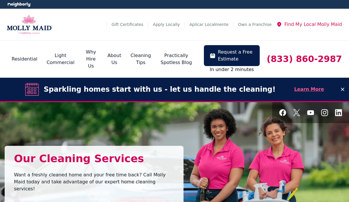 Two women in pink Molly Maid uniforms smile while standing outside holding cleaning supplies. The cleaning service website header features company branding, navigation links, a phone number, and a banner promoting cleaning services.