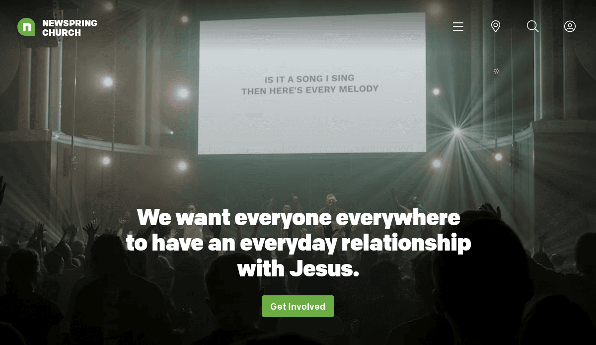 A crowd faces a brightly lit stage with a screen displaying lyrics. Text overlay reads: We want everyone everywhere to have an everyday relationship with Jesus. This homepage is designed as a powerful ministry tool. A green button below says Get Involved.