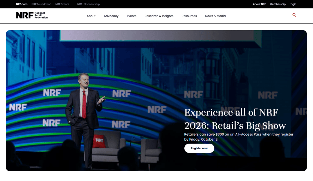 A man in a suit stands on stage speaking at the NRF conference, with “NRF” logos and blue-green graphics behind him. Text on screen promotes registering for NRF 2026: Retail’s Big Show and showcases sleek conference website design elements.