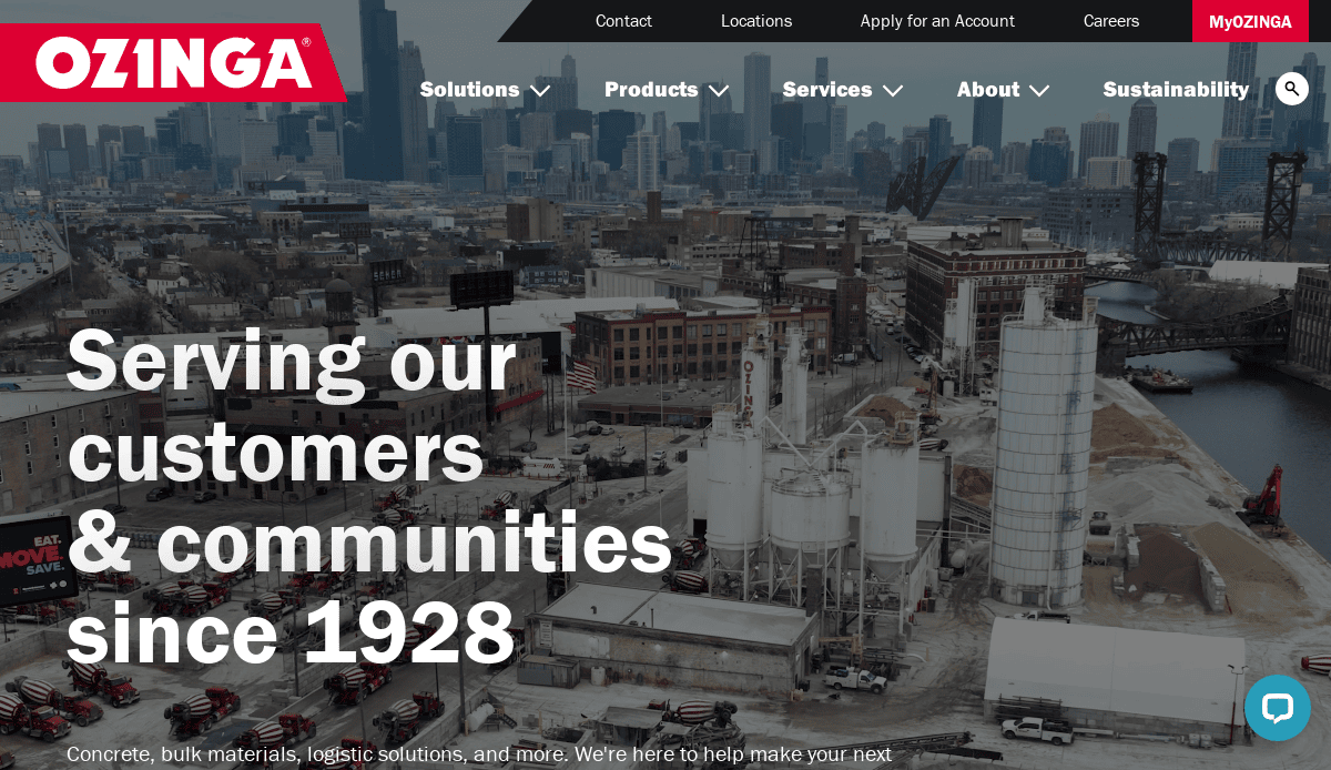 Aerial view of an industrial site with cement silos, trucks, and buildings against a city skyline. Text reads: “Serving our customers & communities since 1928.” Ozinga logo is in the top left, showcasing a website design that attracts and converts visitors.