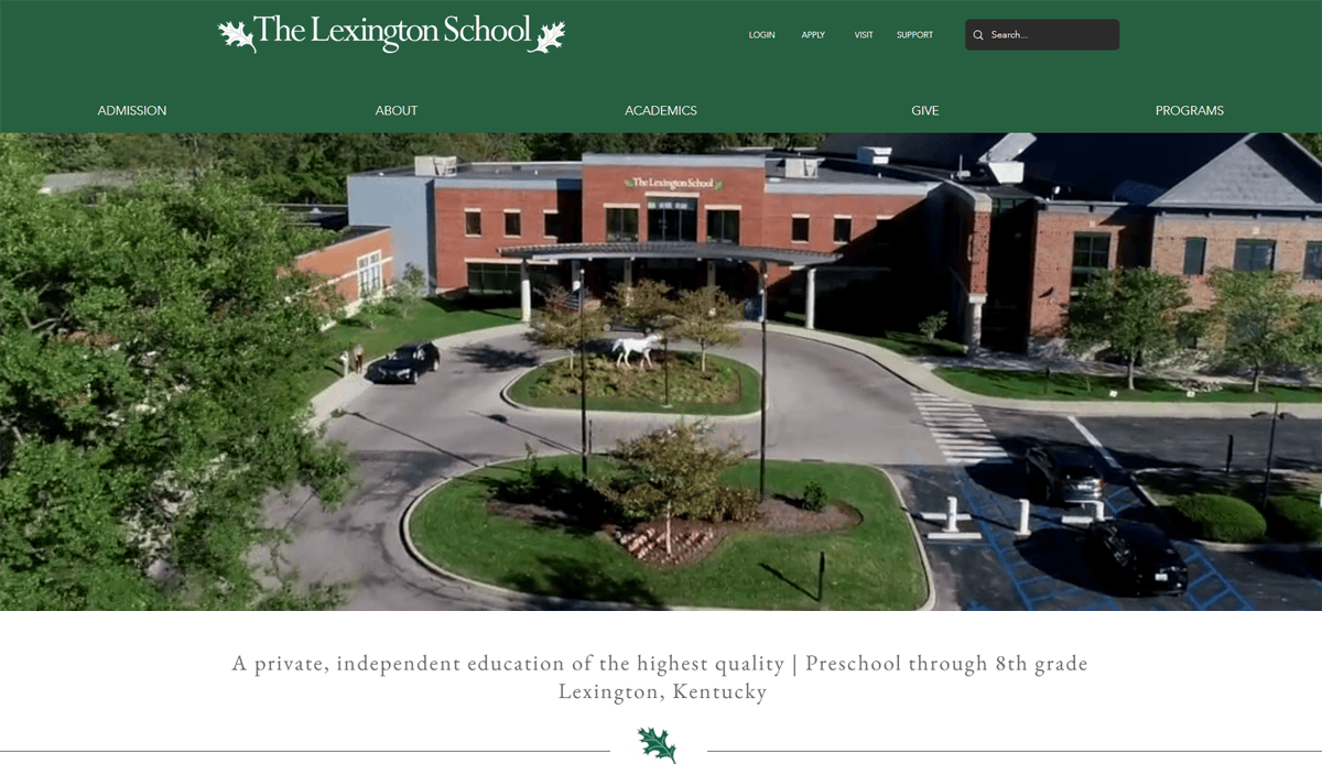 Aerial view of The Lexington School’s main entrance, featuring a red brick building, circular driveway, landscaped greenery, and parked cars—showcasing the best school website design with the school logo and navigation menu at the top.