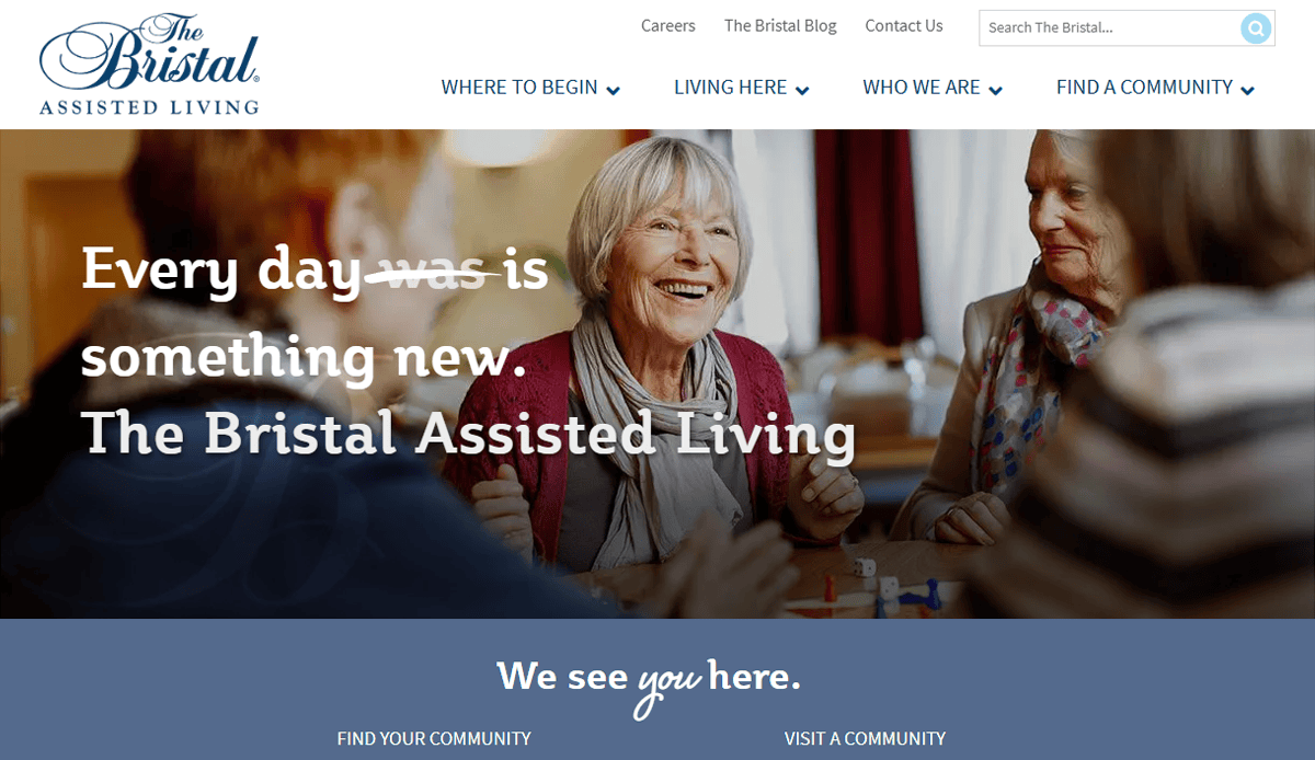 Three older women sit smiling and talking around a table at The Bristal Assisted Living, with board games and drinks in front of them—a bright scene that reflects the welcoming community showcased on their Assisted Living Website.