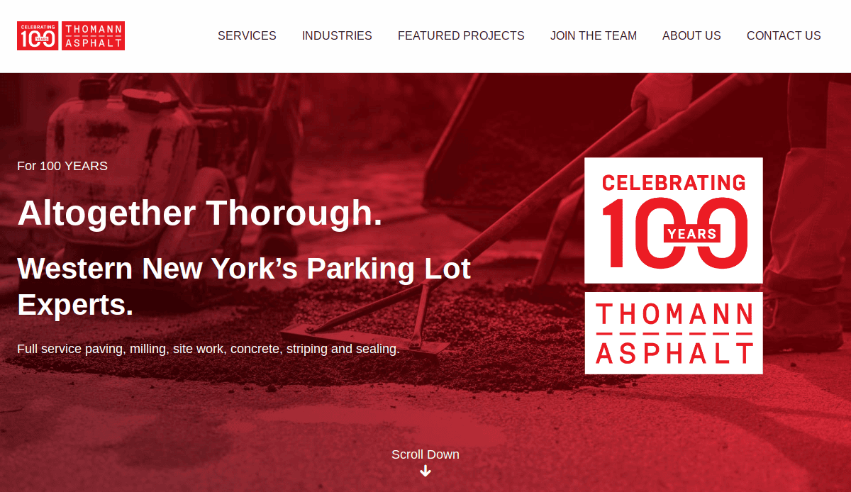 A red-tinted website homepage for Thomann Asphalt, a top asphalt contractor, featuring a logo, navigation menu, workers laying asphalt, and text: “Altogether Thorough. Western New York’s Parking Lot Experts. Celebrating 100 Years.”.