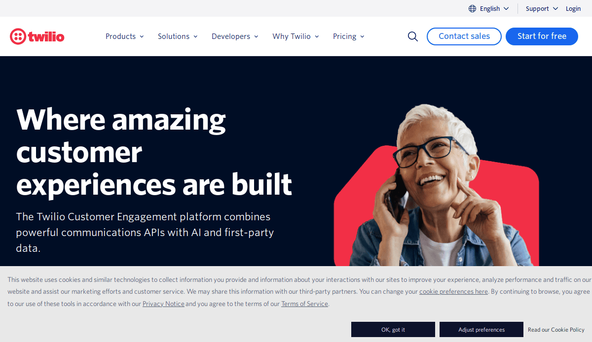 A smiling person with short white hair and glasses talks on a smartphone. Large text reads, Where amazing customer experiences are built, with a digital brochure of Twilio’s customer engagement platform on the left. Twilio branding appears at the top.