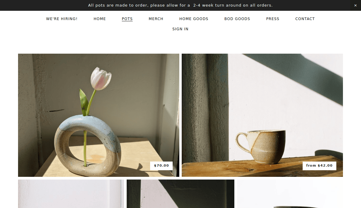 Showcased in bright natural light, this artisan website section features a round vase with a pink tulip for $70.00 on the left and a beige mug starting at $42.00 on the right—perfect inspiration for refined artisan website design.