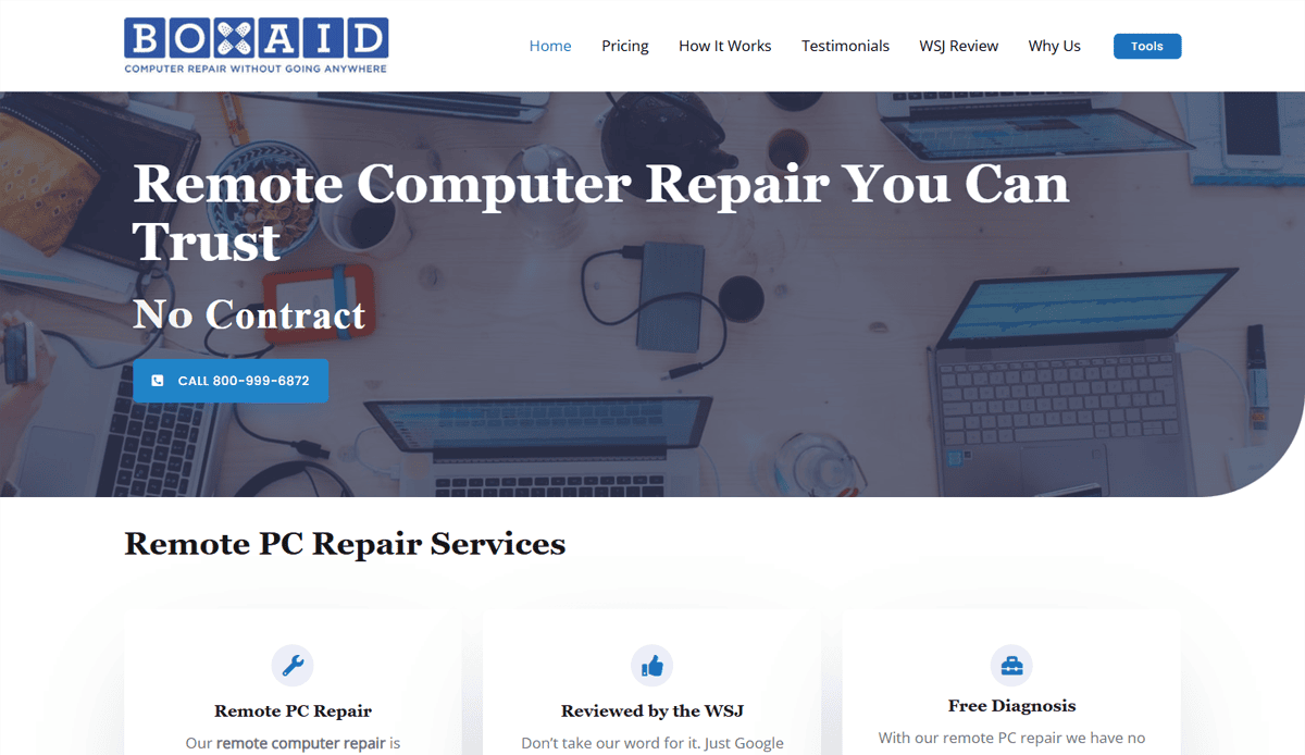 Screenshot of BoxAids homepage featuring a bold header: Remote Computer Repair You Can Trust. No Contract. A blue call button, laptops on a desk, and service options are shown—highlighting their expert computer repair for 2025.